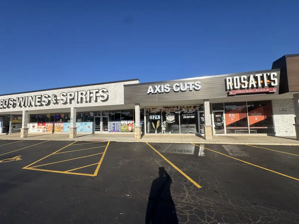 Axis Cuts storefront at 3016 Hobson Rd, Woodridge, between the liquor store and Rosati’s